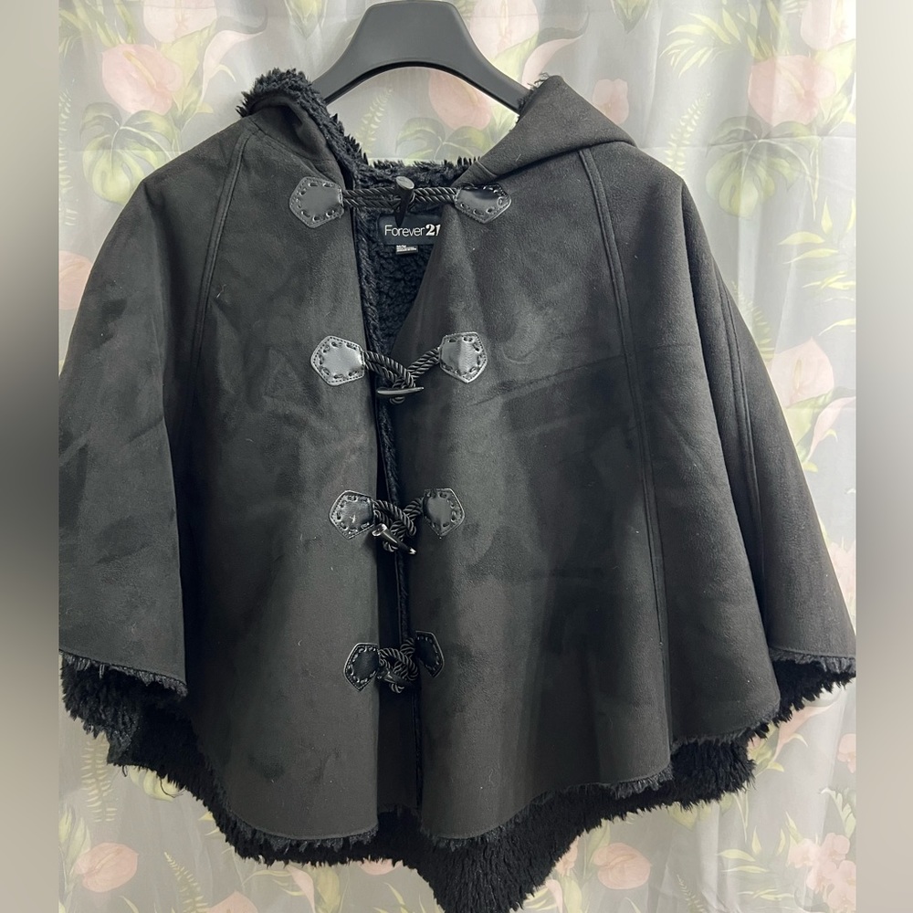 Black cape with hood and furry . Like new